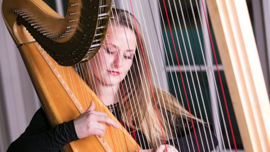 student playing harp